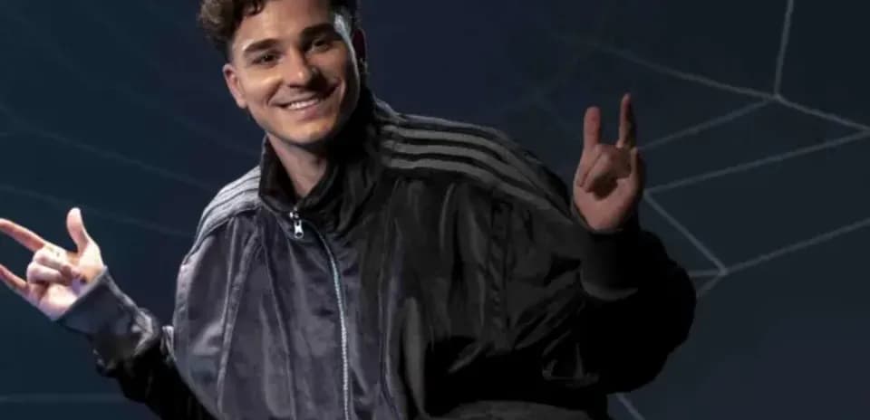 Young man posing with hands in a jacket