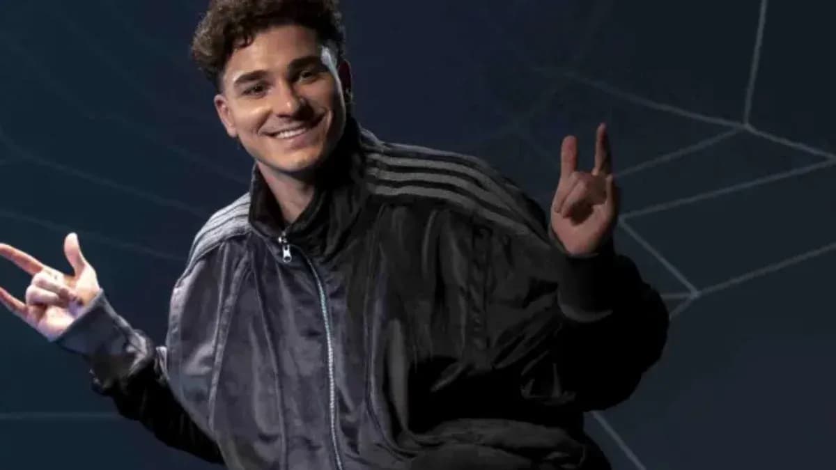 Young man posing with hands in a jacket