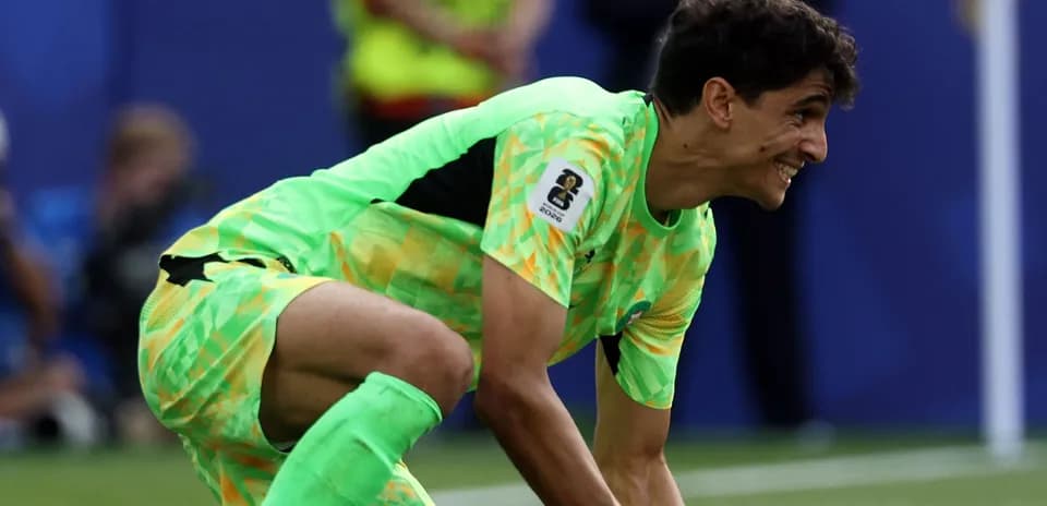 Goalkeeper in bright uniform preparing for play