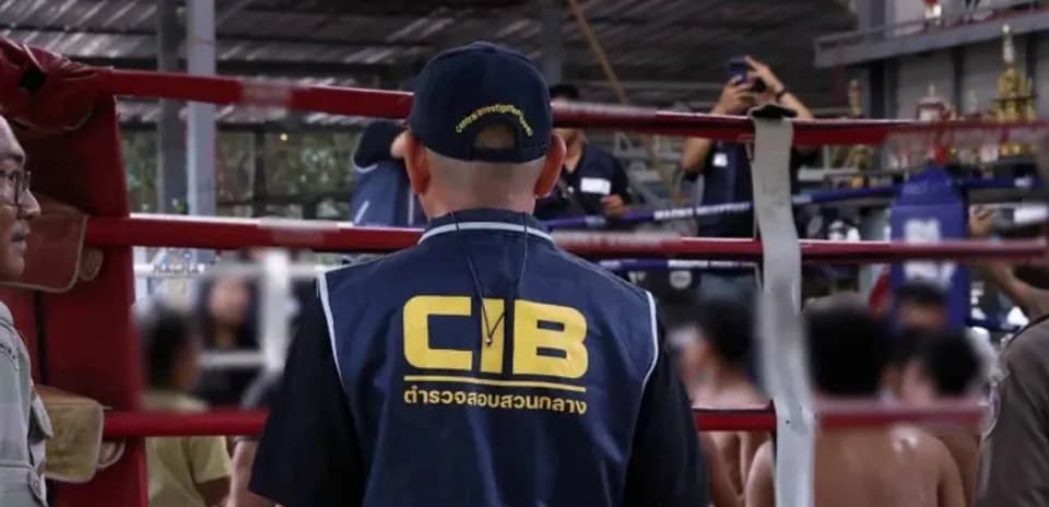 CIB officer observing boxing match in training area