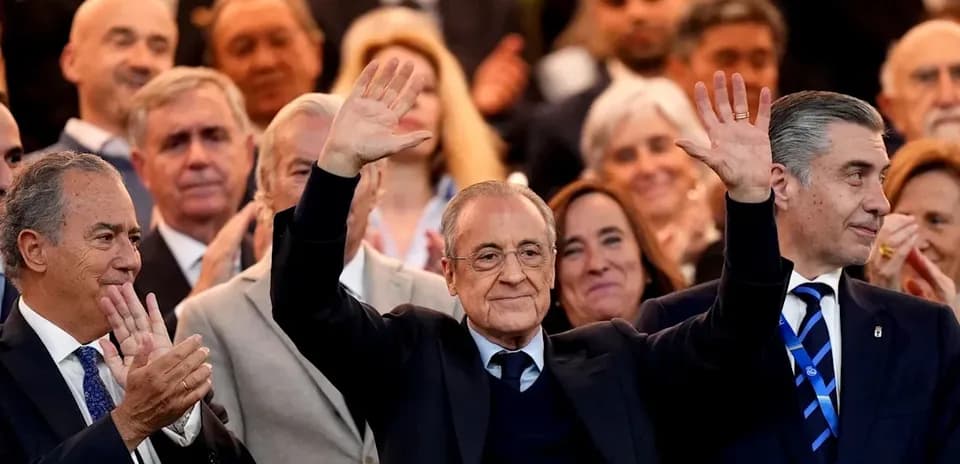 People applauding with a prominent figure waving