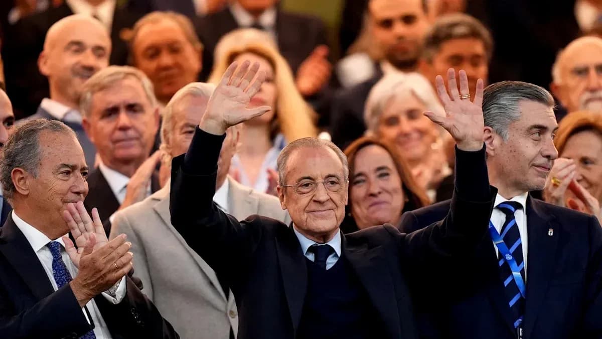 People applauding with a prominent figure waving