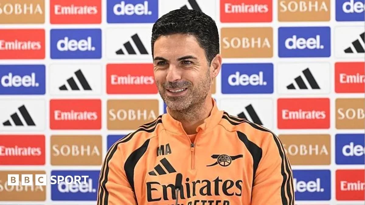 Mikel Arteta speaking at press conference with backdrop