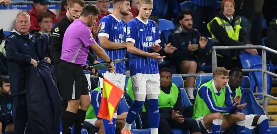 Substitutes preparing to enter the pitch during match