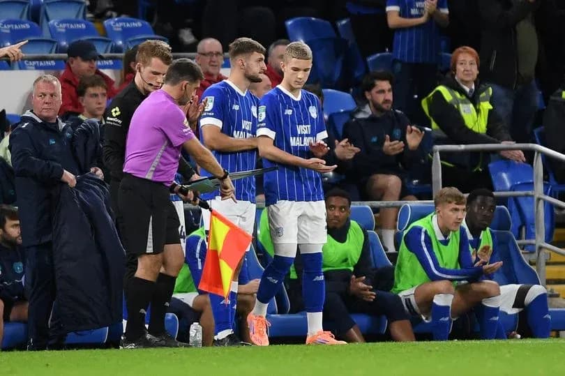 Substitutes preparing to enter the pitch during match