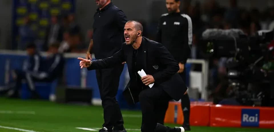 Trainers directing players during a match on the sideline