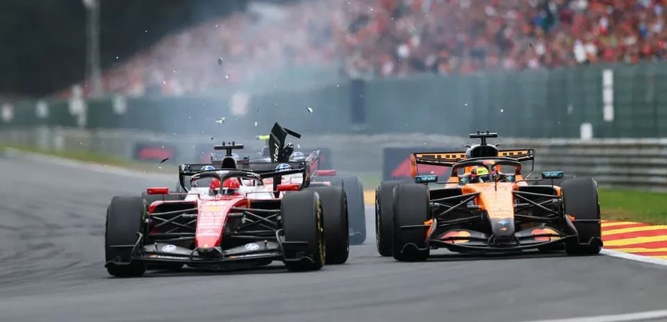 Ferrari and McLaren cars colliding on track