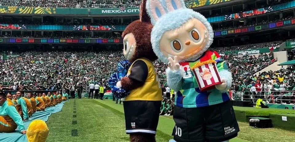 Two mascots on field during World Cup event