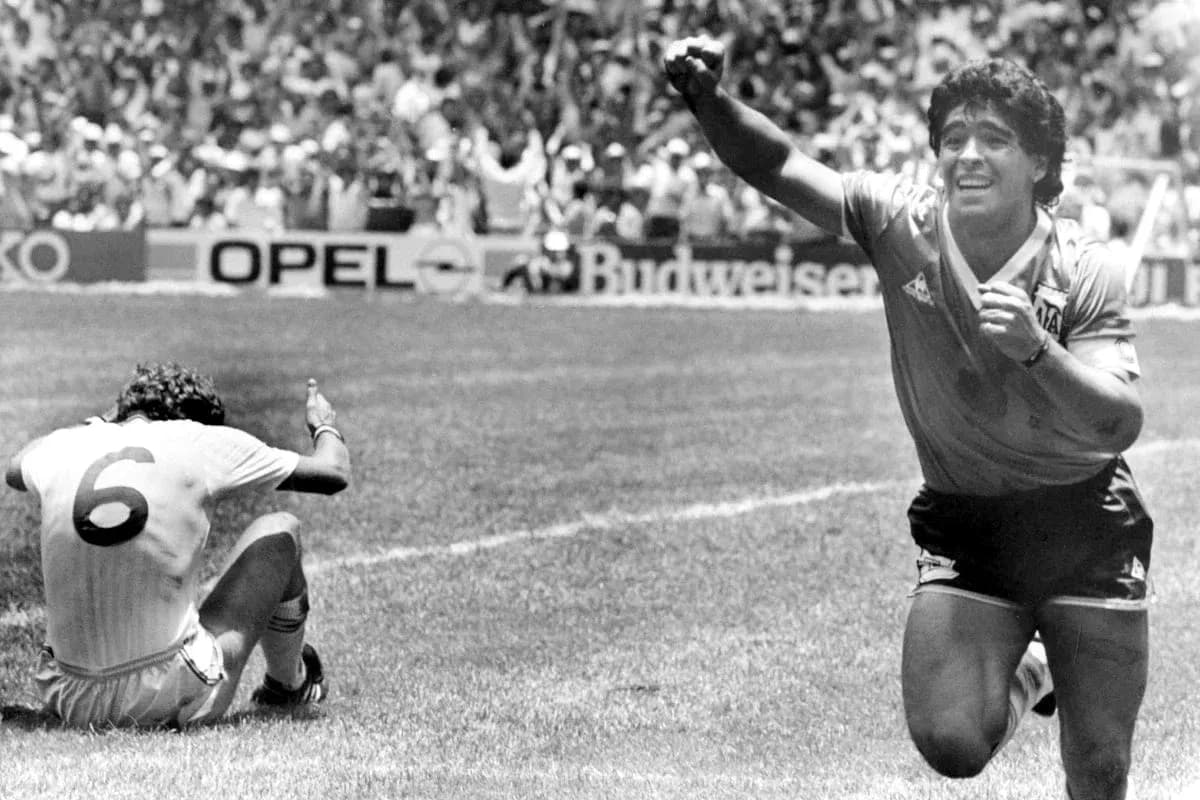 Diego Maradona celebrating a goal during a match Diego Maradona celebrating a goal during a match