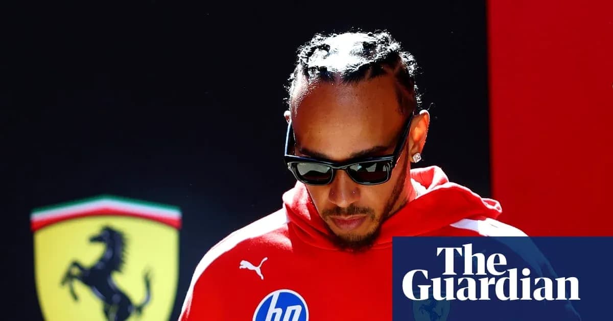 Formula 1 driver in red team gear walking Formula 1 driver in red team gear walking