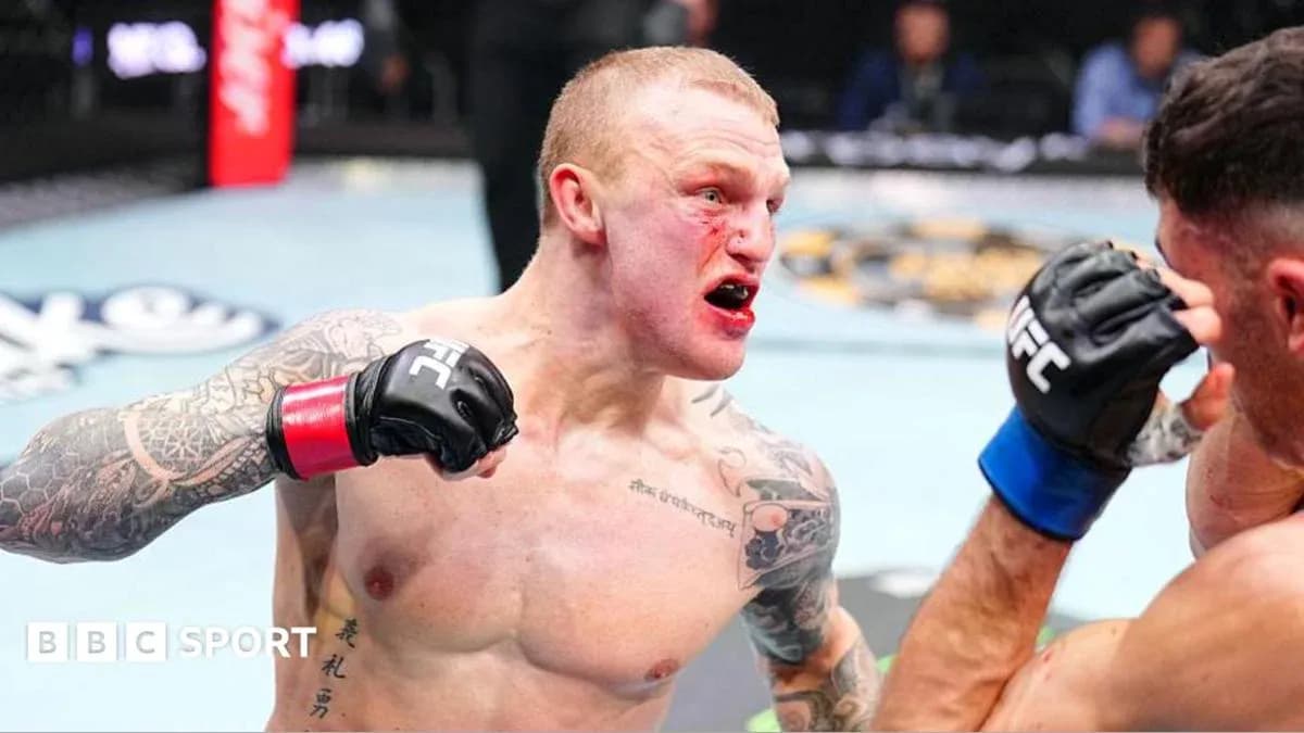Fighter delivering a punch in UFC match Fighter delivering a punch in UFC match