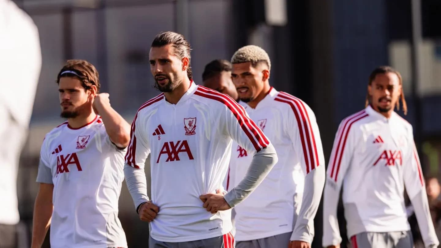 Liverpool players during training session on pitch Liverpool players during training session on pitch