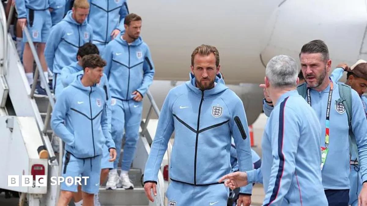 England team disembarking from airplane in blue tracksuits England team disembarking from airplane in blue tracksuits