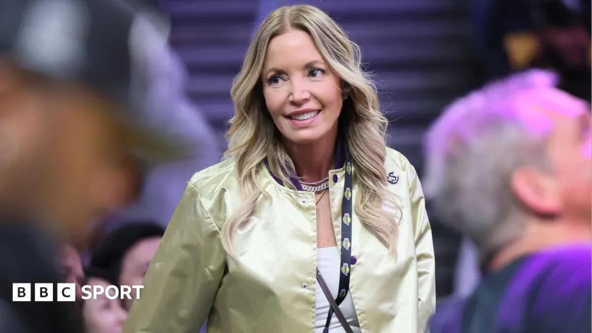 Woman in a golden jacket at basketball game Woman in a golden jacket at basketball game