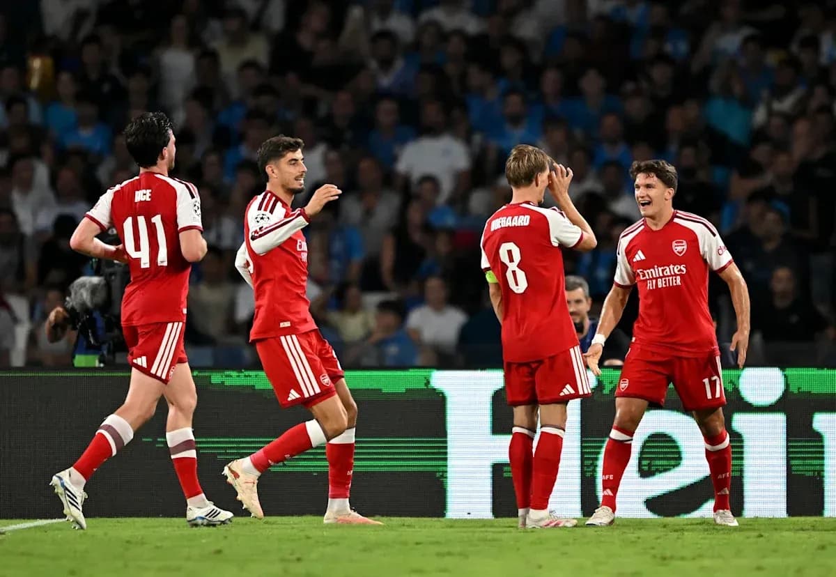 Arsenal players celebrating during a match Arsenal players celebrating during a match