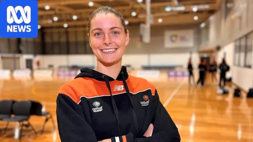 Athlete smiling in netball training venue Athlete smiling in netball training venue