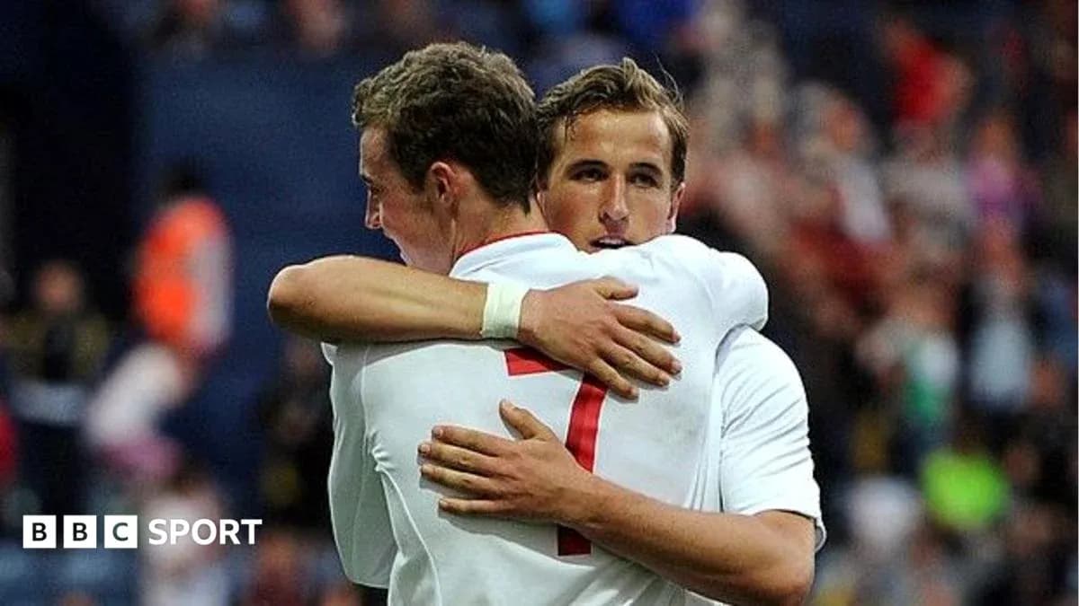 Two players embracing on the football field Two players embracing on the football field