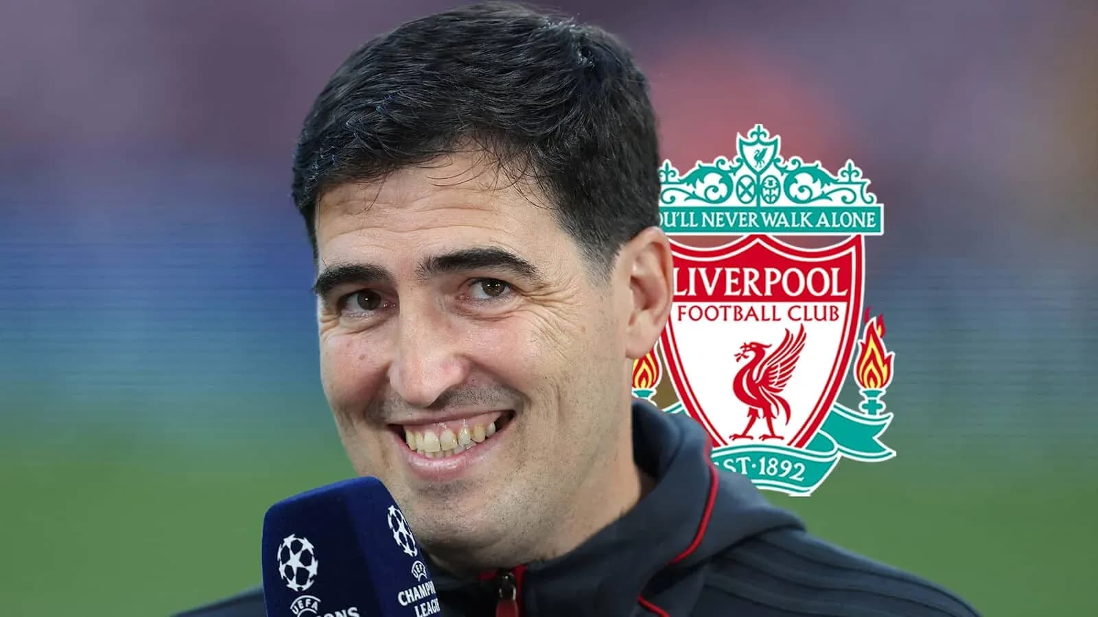 Reporter smiling with Liverpool logo in background Reporter smiling with Liverpool logo in background