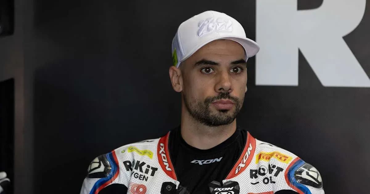 Motorsport athlete in racing suit and cap Motorsport athlete in racing suit and cap