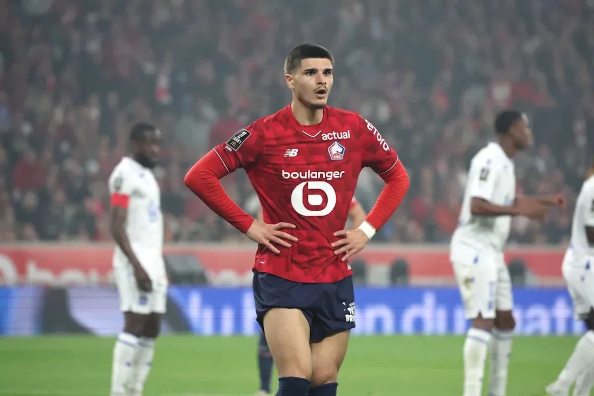 Lille player standing on field during match Lille player standing on field during match