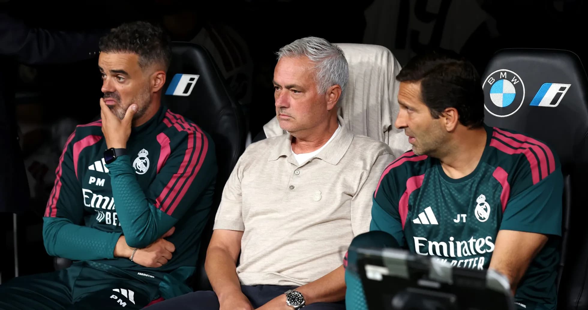Real Madrid coaching staff seated on the bench Real Madrid coaching staff seated on the bench