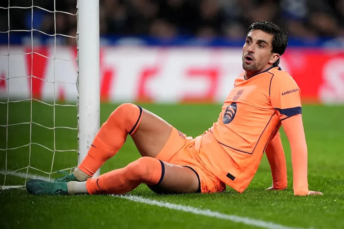 Goalkeeper sitting by the goalpost during match Goalkeeper sitting by the goalpost during match