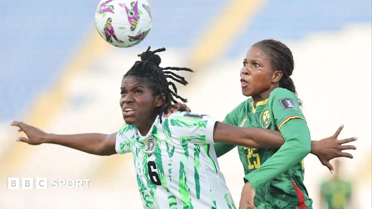 Two players contesting a high ball during match Two players contesting a high ball during match