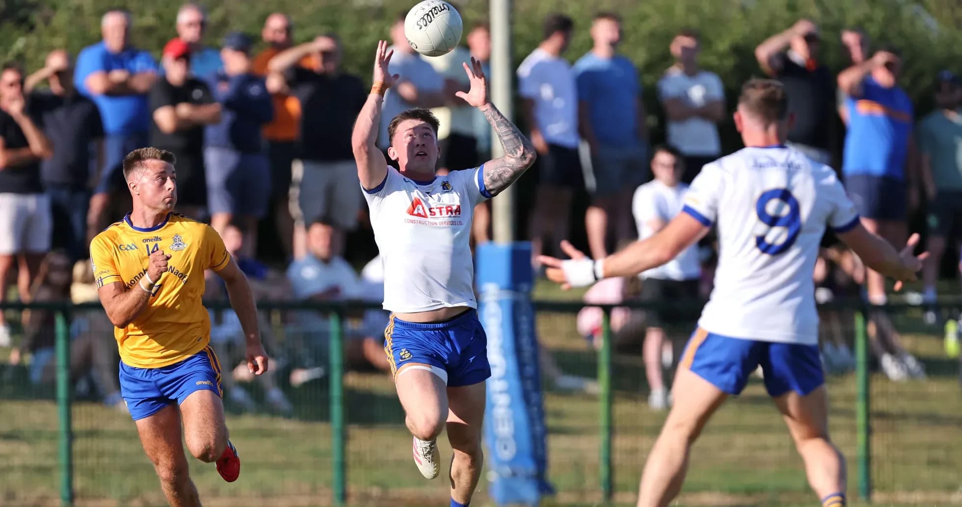 Player catching ball during a rugby match Player catching ball during a rugby match
