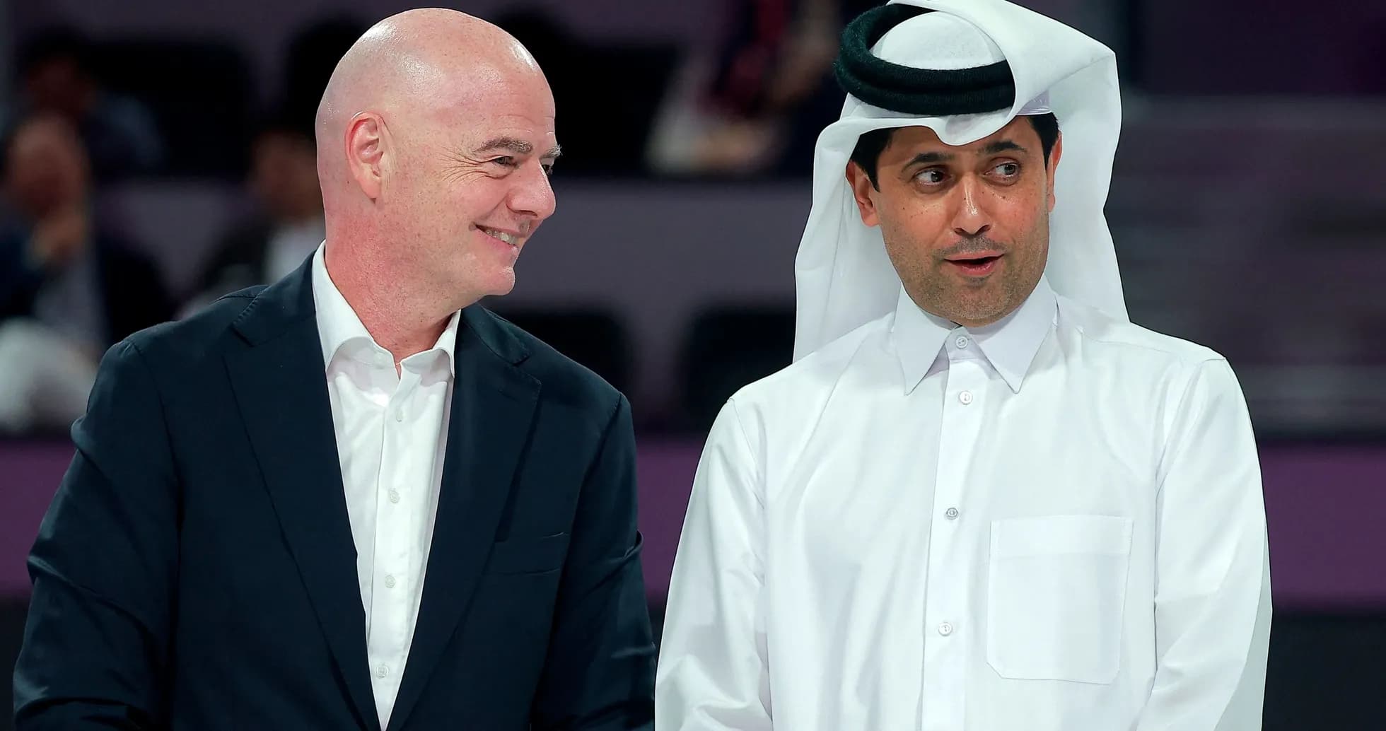 Two officials conversing at event in Qatar Two officials conversing at event in Qatar