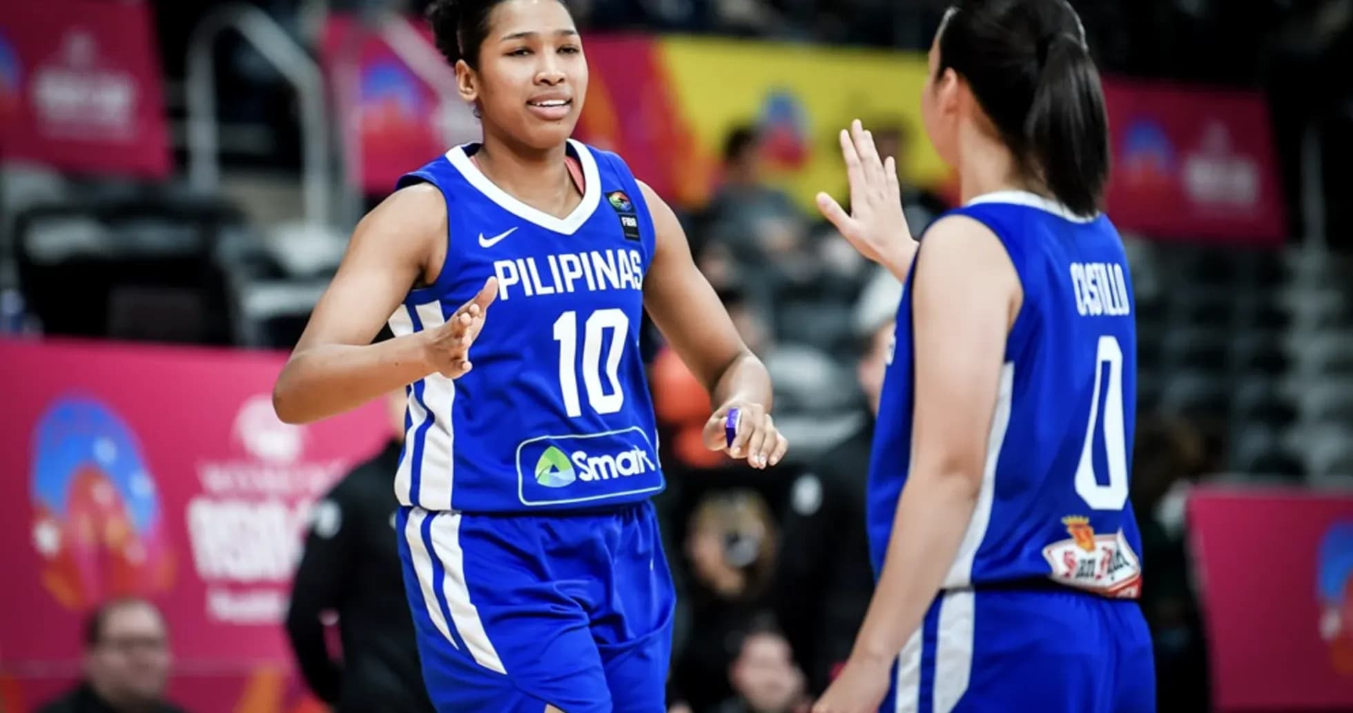 Two basketball players celebrating during the game Two basketball players celebrating during the game
