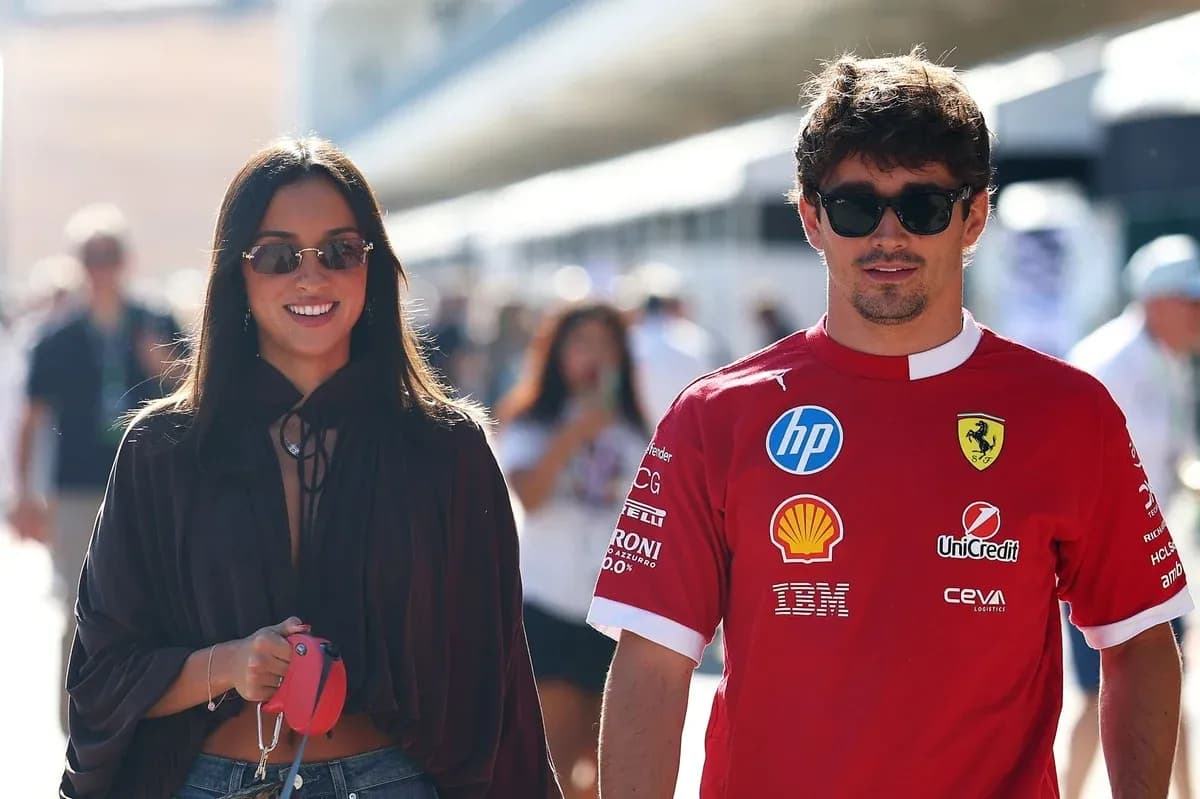 Couple walking together at racing event Couple walking together at racing event