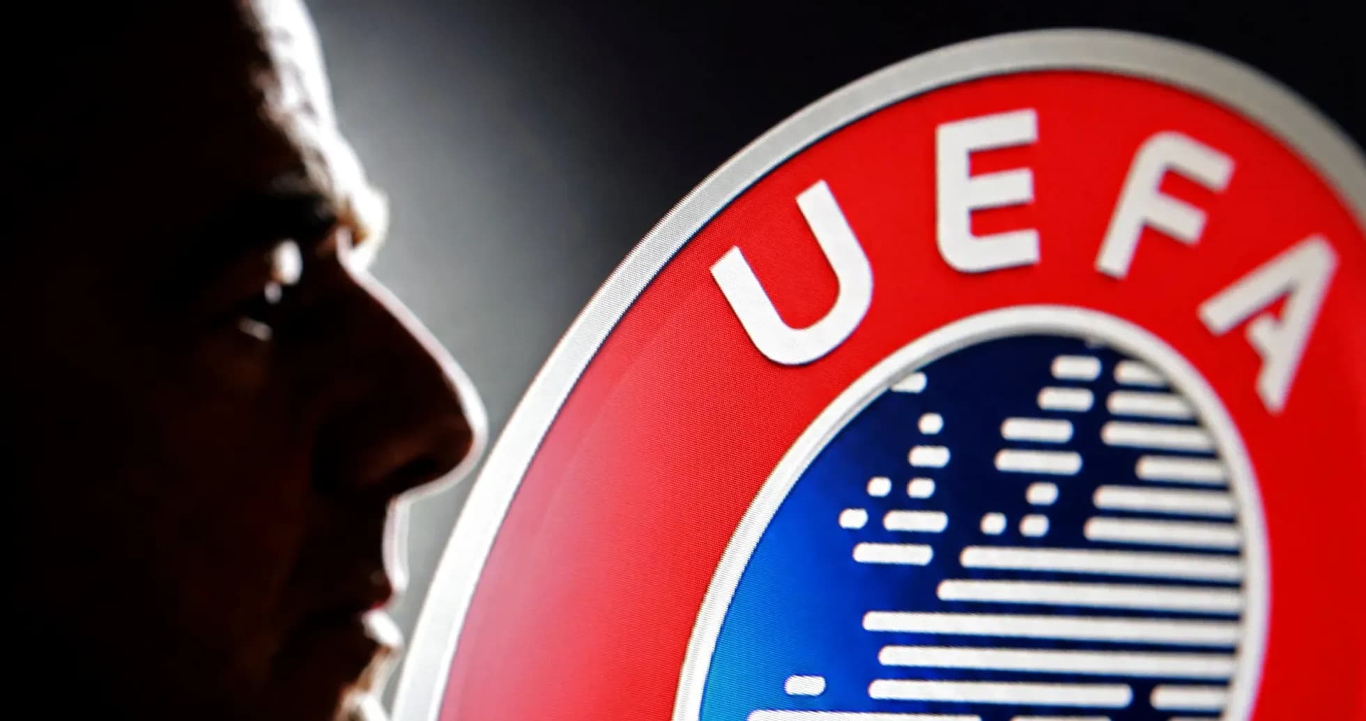 Shadows of a person next to UEFA logo Shadows of a person next to UEFA logo