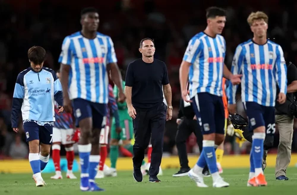 Coventry City players leaving the pitch after match Coventry City players leaving the pitch after match