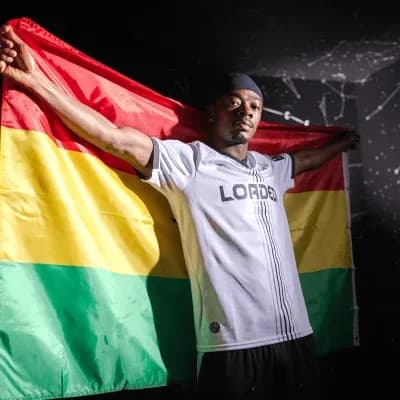 Player holding Bolivia flag in celebration Player holding Bolivia flag in celebration