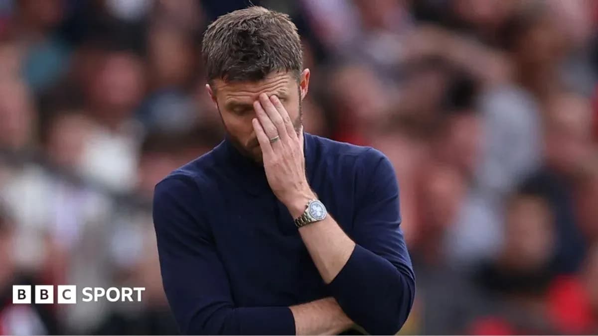 Men's football coach with hand on face during match Men's football coach with hand on face during match