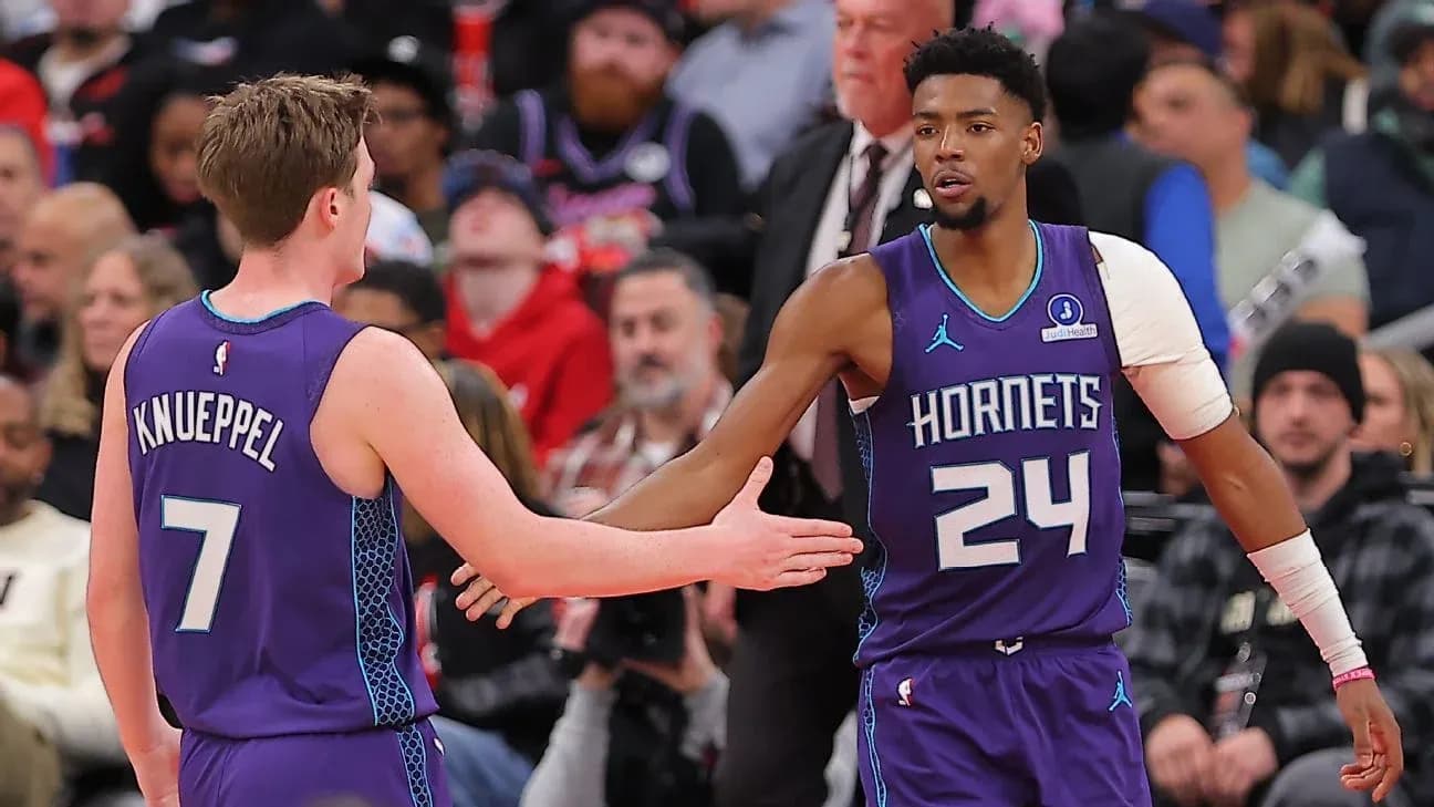Hornets players greeting each other during game Hornets players greeting each other during game