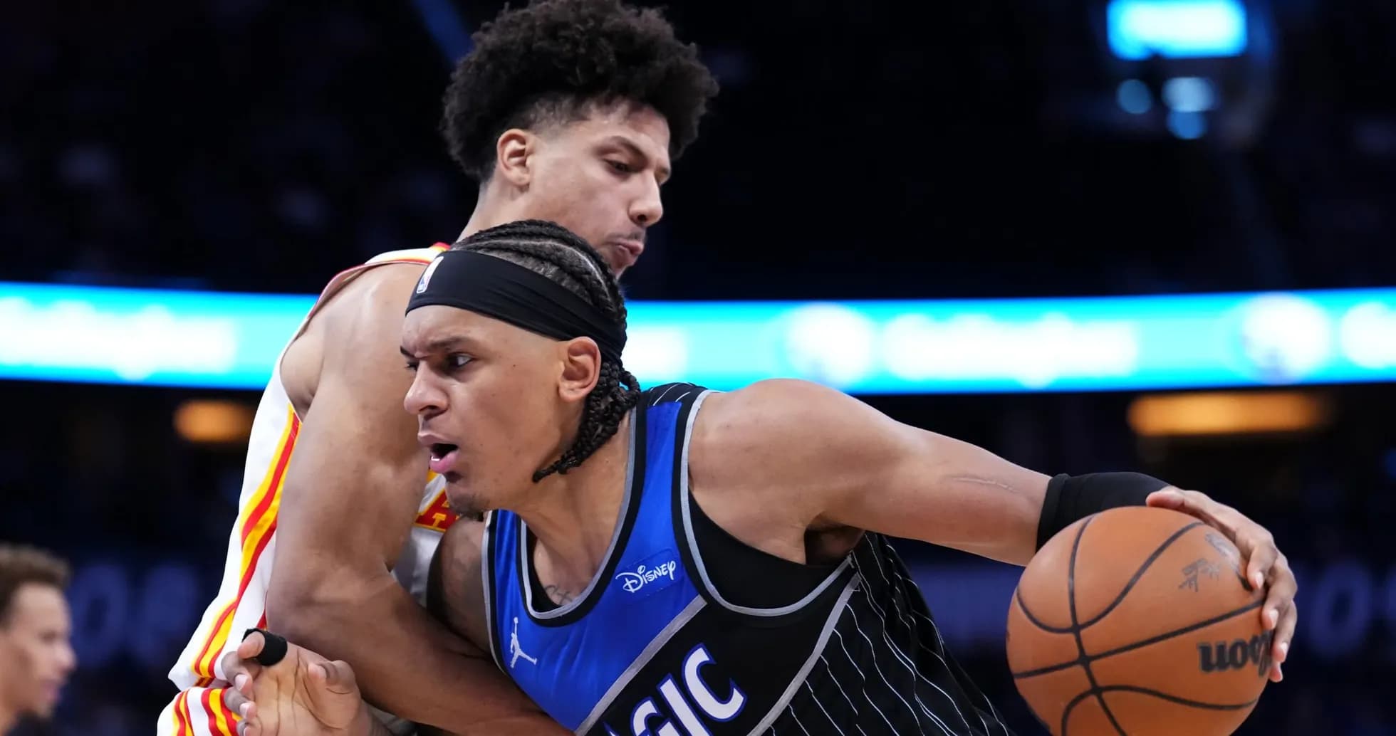 Two basketball players competing for possession of the ball Two basketball players competing for possession of the ball