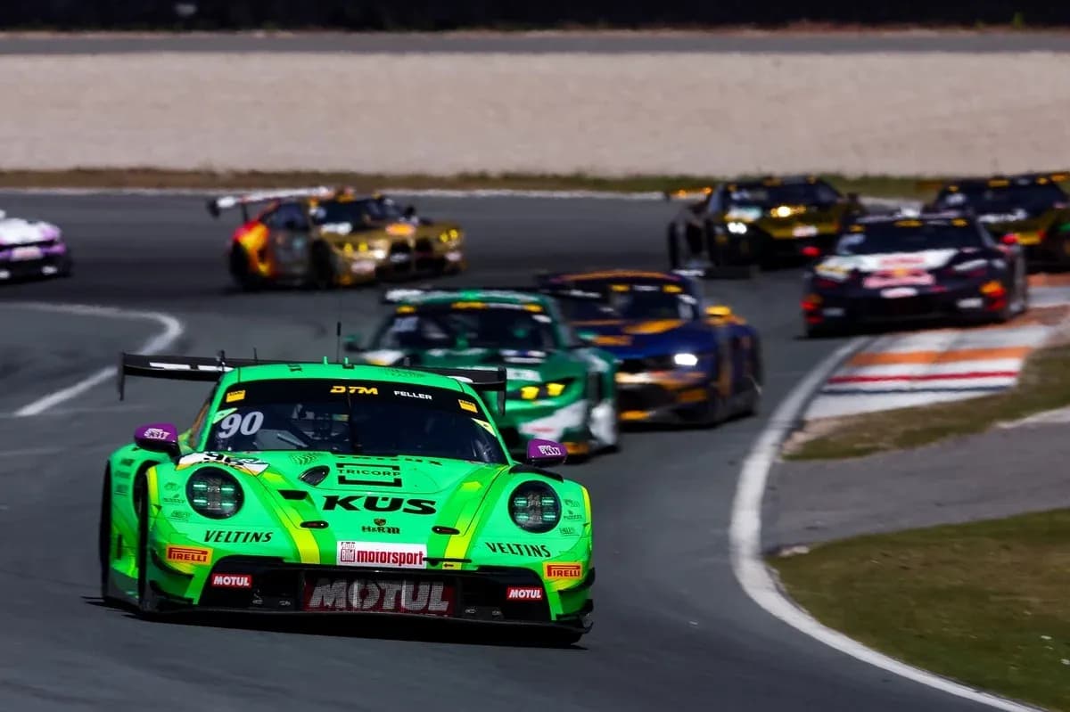 Green race car leading a group on the track Green race car leading a group on the track