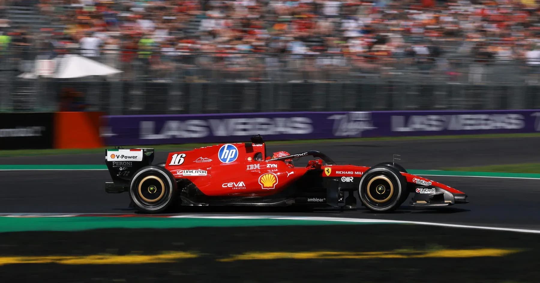 Ferrari car racing on track during Formula 1 event Ferrari car racing on track during Formula 1 event