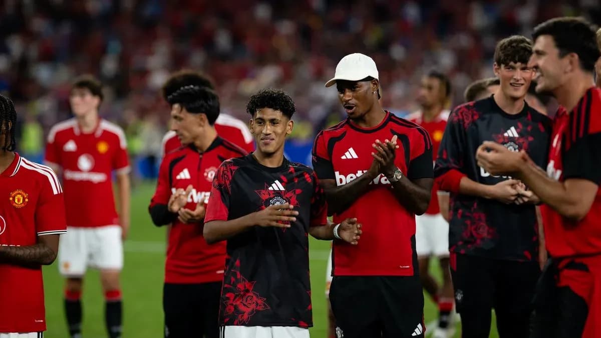 Manchester United players celebrating after a match Manchester United players celebrating after a match