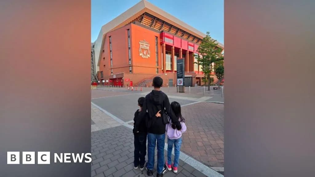 Three children in front of Anfield stadium Three children in front of Anfield stadium