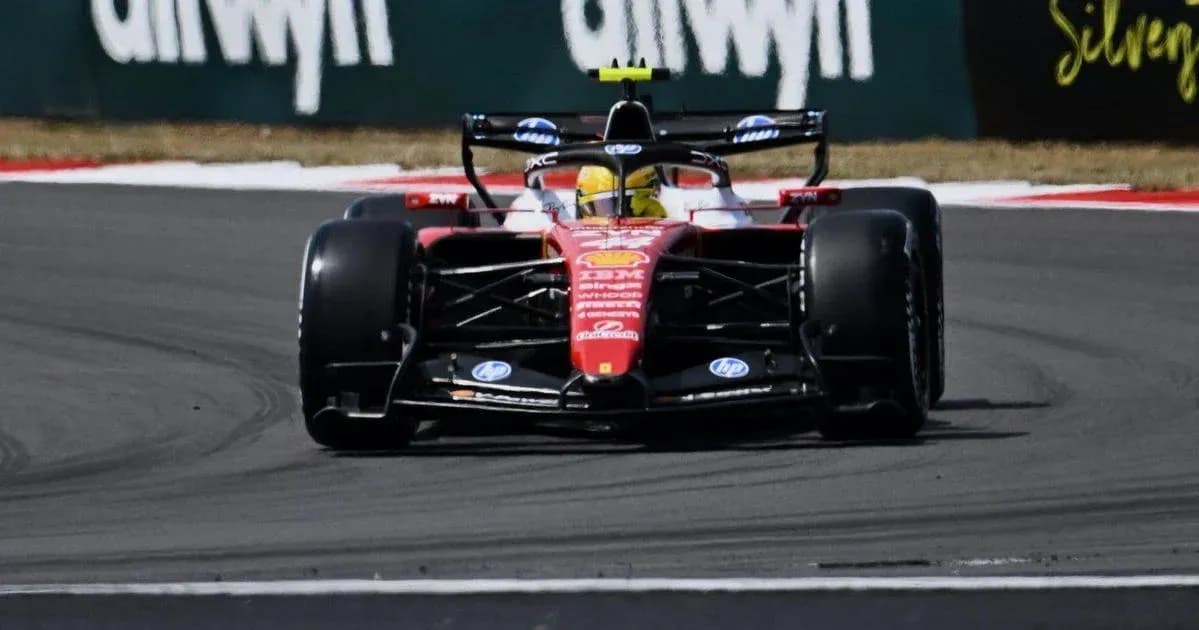 Formula 1 car navigating a turn on track Formula 1 car navigating a turn on track