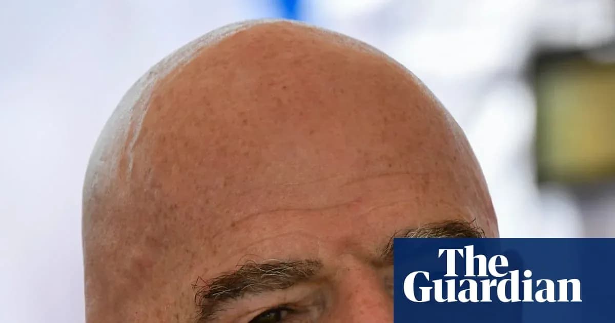 Bald man with eyebrows looking at camera Bald man with eyebrows looking at camera