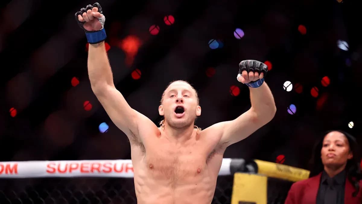 MMA fighter celebrating victory in the octagon MMA fighter celebrating victory in the octagon
