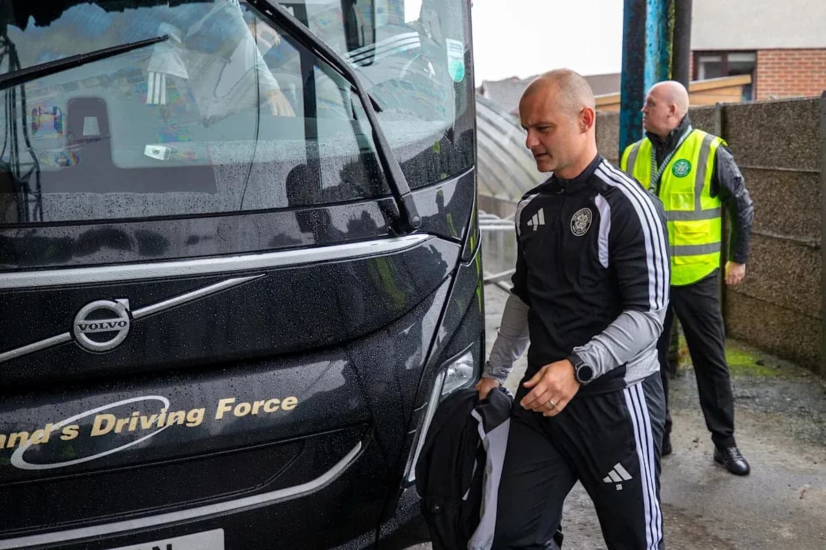 Trainers arriving by team bus in rainy weather Trainers arriving by team bus in rainy weather