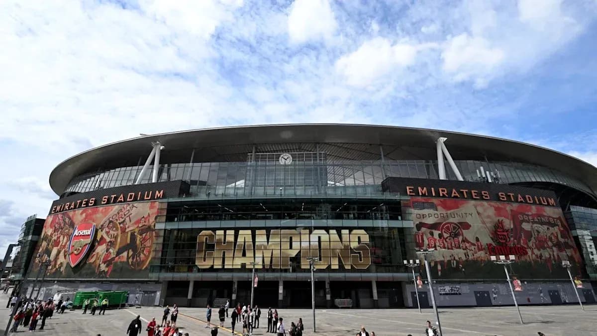 Emirates Stadium exterior with crowds and banners Emirates Stadium exterior with crowds and banners