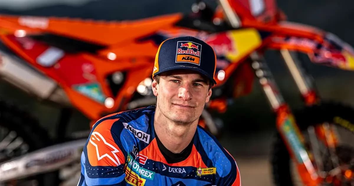 Motocross rider posing with KTM motorcycle Motocross rider posing with KTM motorcycle