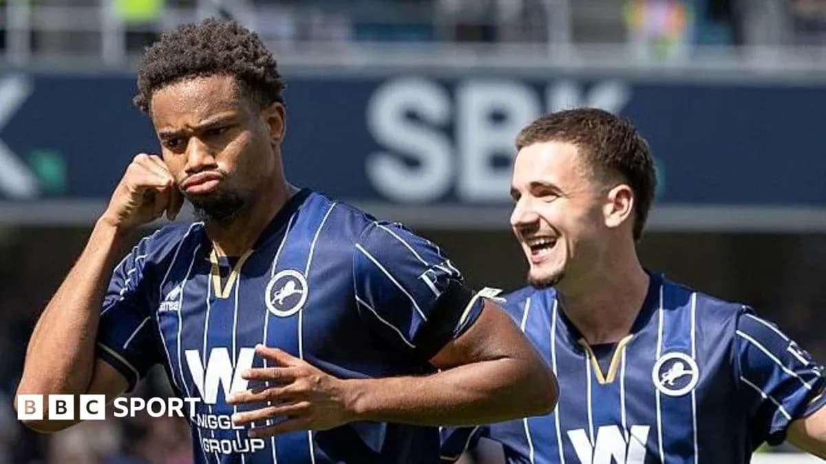 Millwall players celebrating a goal on the pitch Millwall players celebrating a goal on the pitch