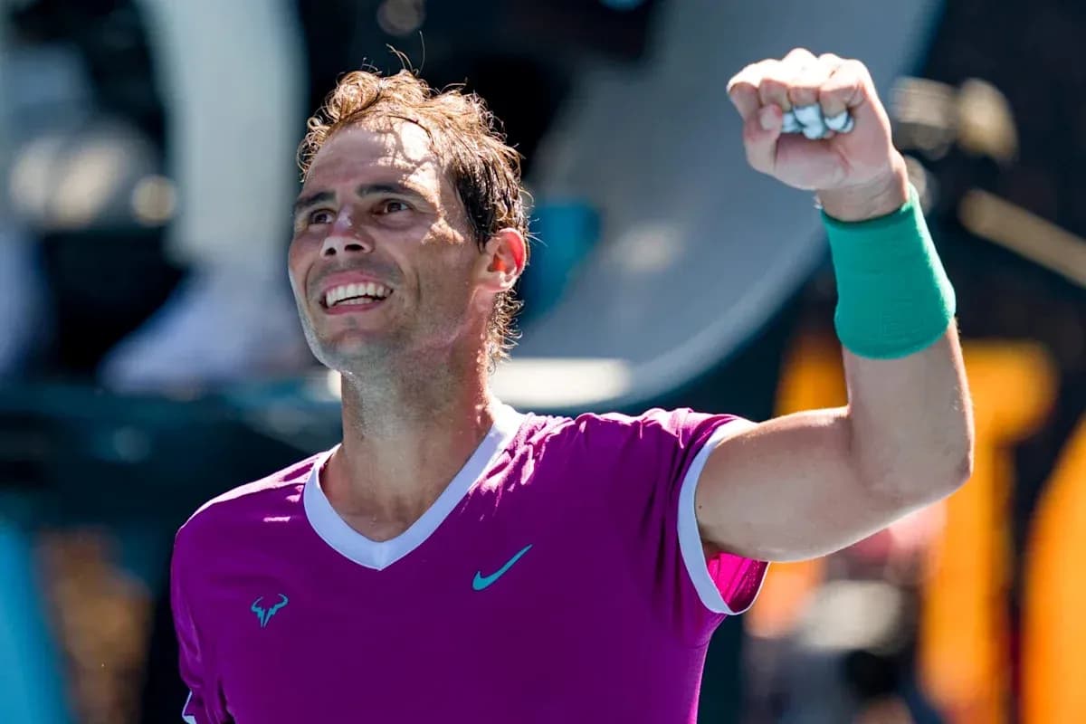 Tennis player celebrating victory with raised fist Tennis player celebrating victory with raised fist