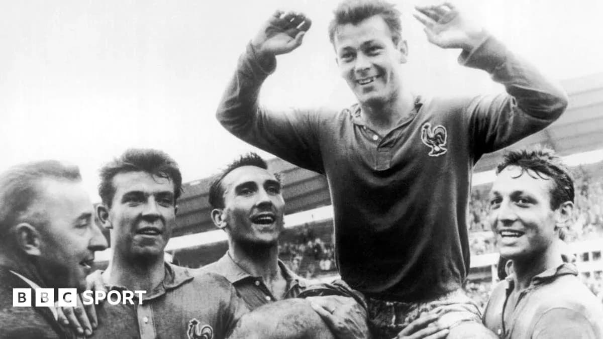 Football players celebrating victory, one lifted in air Football players celebrating victory, one lifted in air